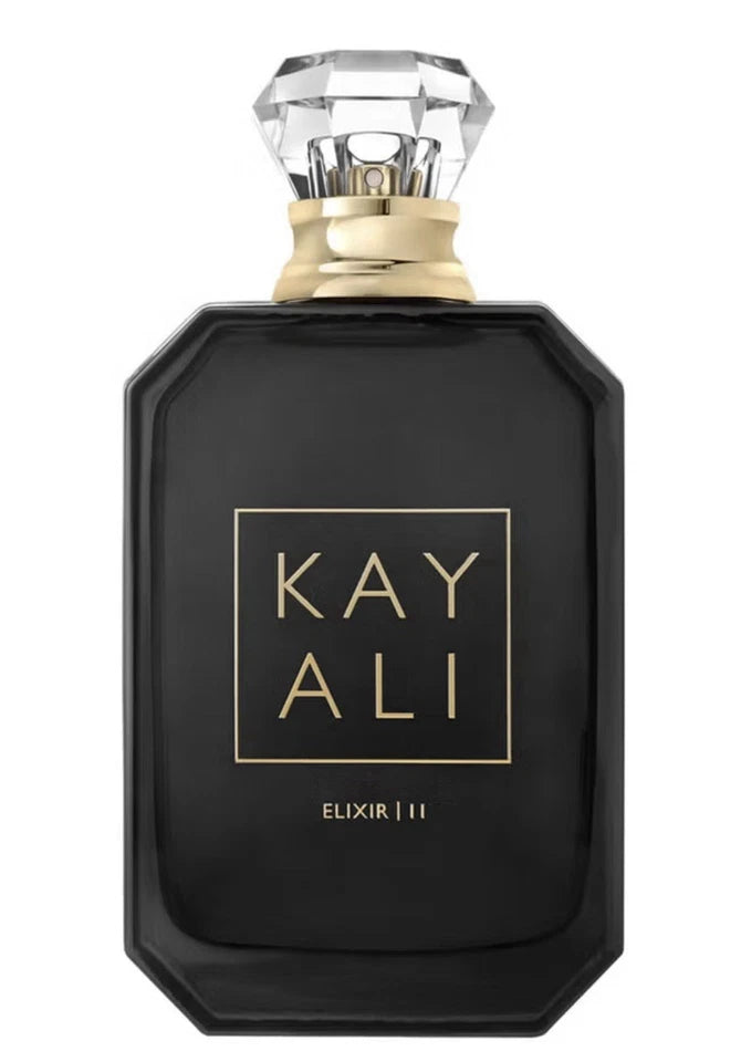 A black rectangular perfume bottle with a faceted clear glass cap and gold lettering that reads 'KAYALI ELIXIR III' on the front, shown against a plain white background.