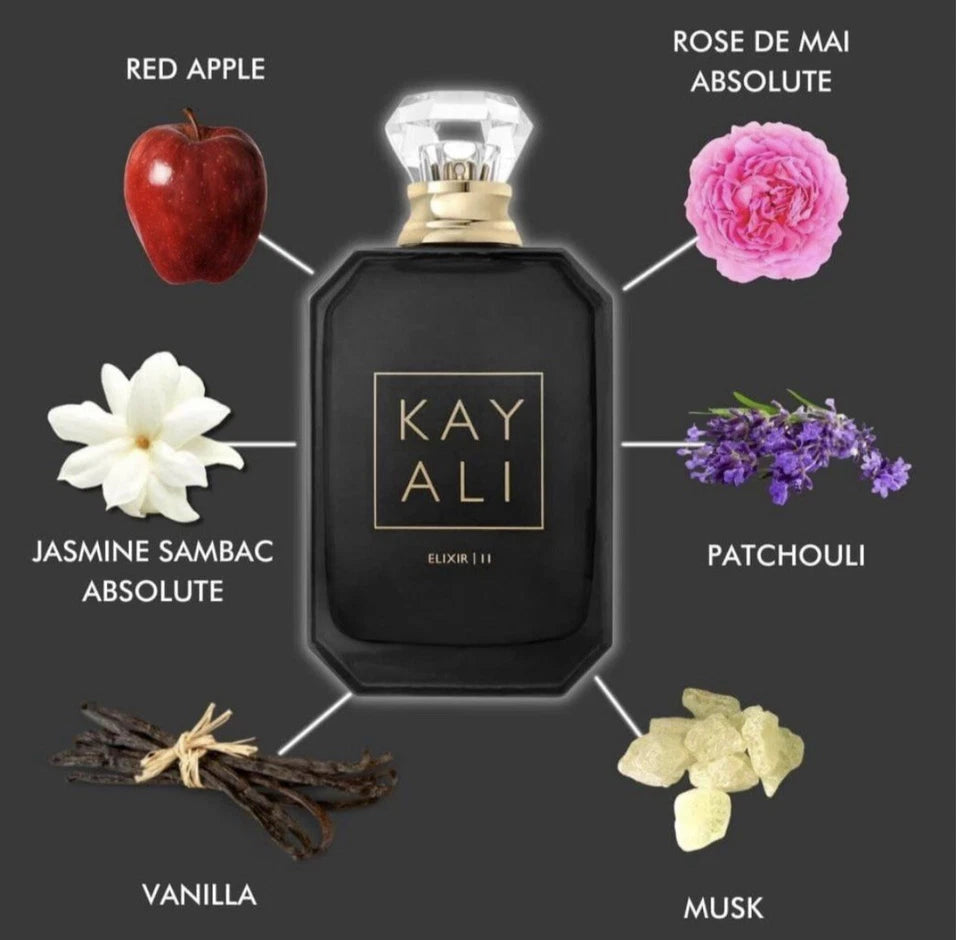 A perfume bottle labeled KAY ALI ELIXIR | 11 centered on a dark gray background, surrounded by ingredient illustrations and names: red apple, rose de mai absolute, jasmine sambac absolute, patchouli, vanilla, and musk.