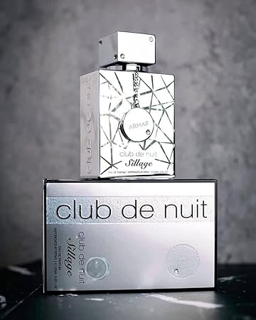 Armaf Club de Nuit Sillage perfume bottle and packaging on a gray background