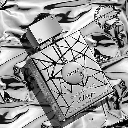 Armaf perfume bottle on a reflective surface