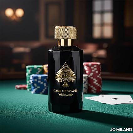 Black perfume bottle with gold accents on a poker table, featuring the brand 'Jomilano'.