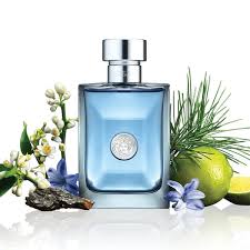Blue perfume bottle with natural elements like flowers and a lime on a white background