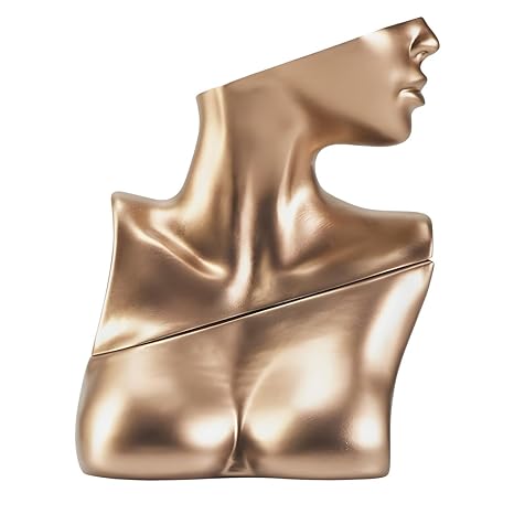 Bronze-colored sculpture of a face on a white background