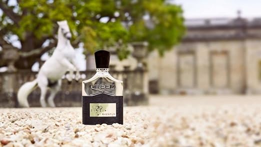 Creed Eternity for Men perfume bottle with a horse in the background