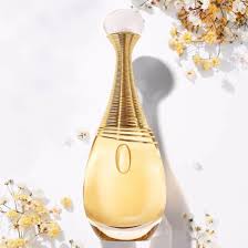 Gold perfume bottle with decorative elements on a light background