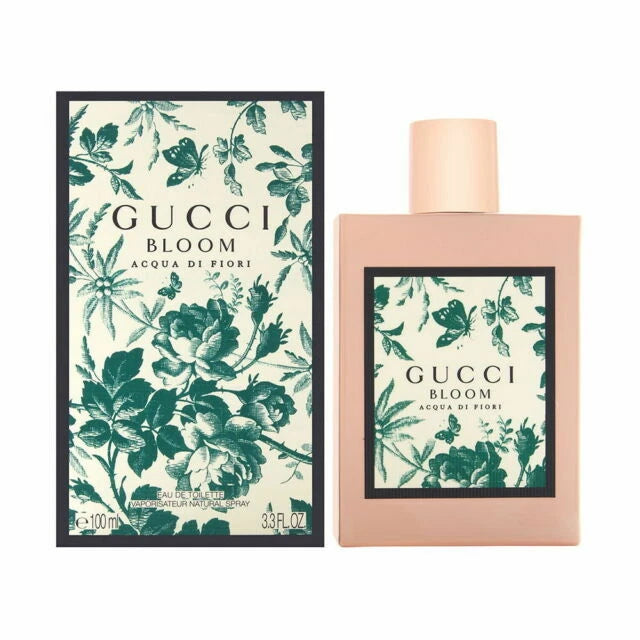 Gucci Bloom perfume bottle and packaging with floral design on a white background