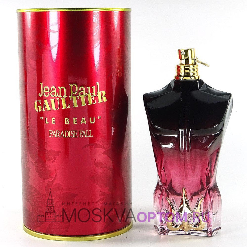 Jean Paul Gaultier Le Beau Paradise Fall perfume bottle and red cylindrical packaging on a white background