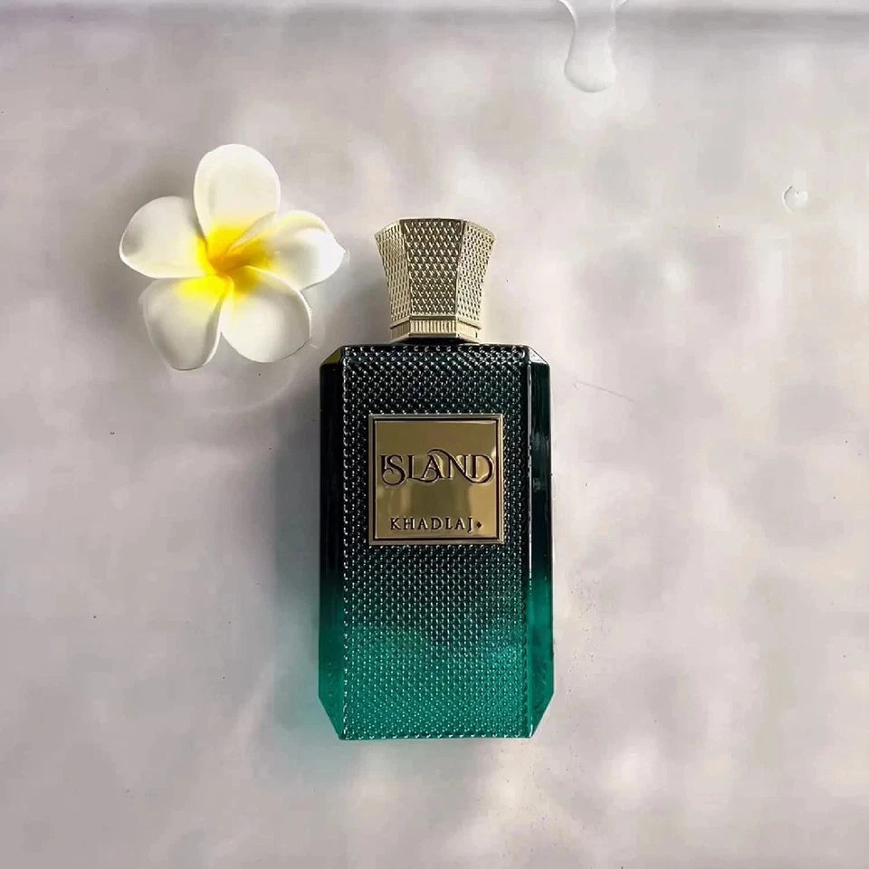 Perfume bottle with a flower on a textured surface