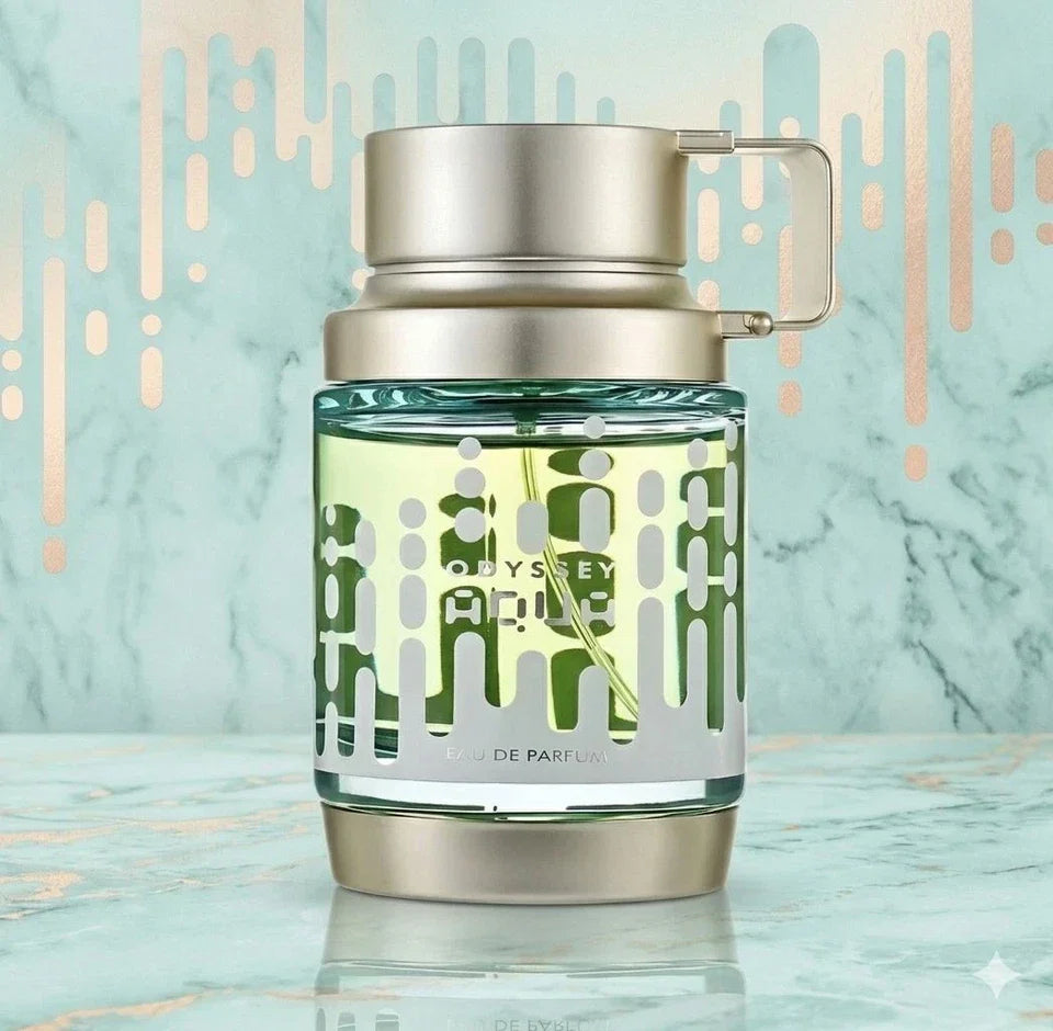 Perfume bottle with silver cap and green glass body on a light blue background