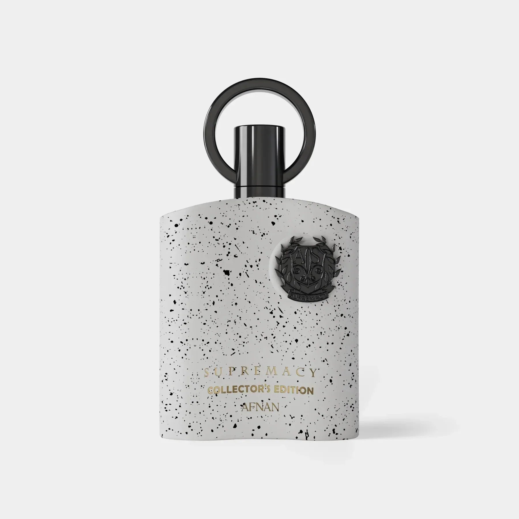 Perfume bottle with speckled design and black cap on a white background