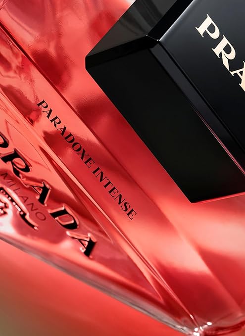 Prada Paradoxe Intense perfume bottle on a red background