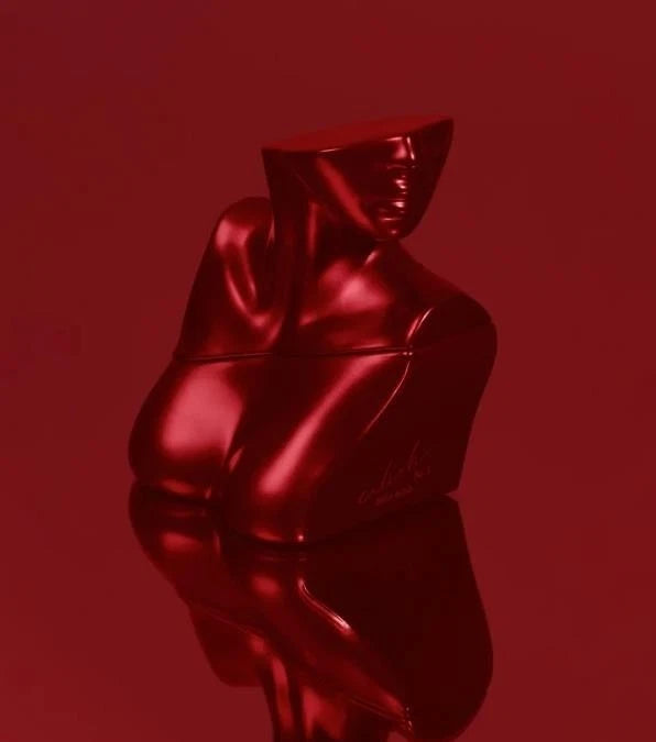 Shiny red statue against a matching red background