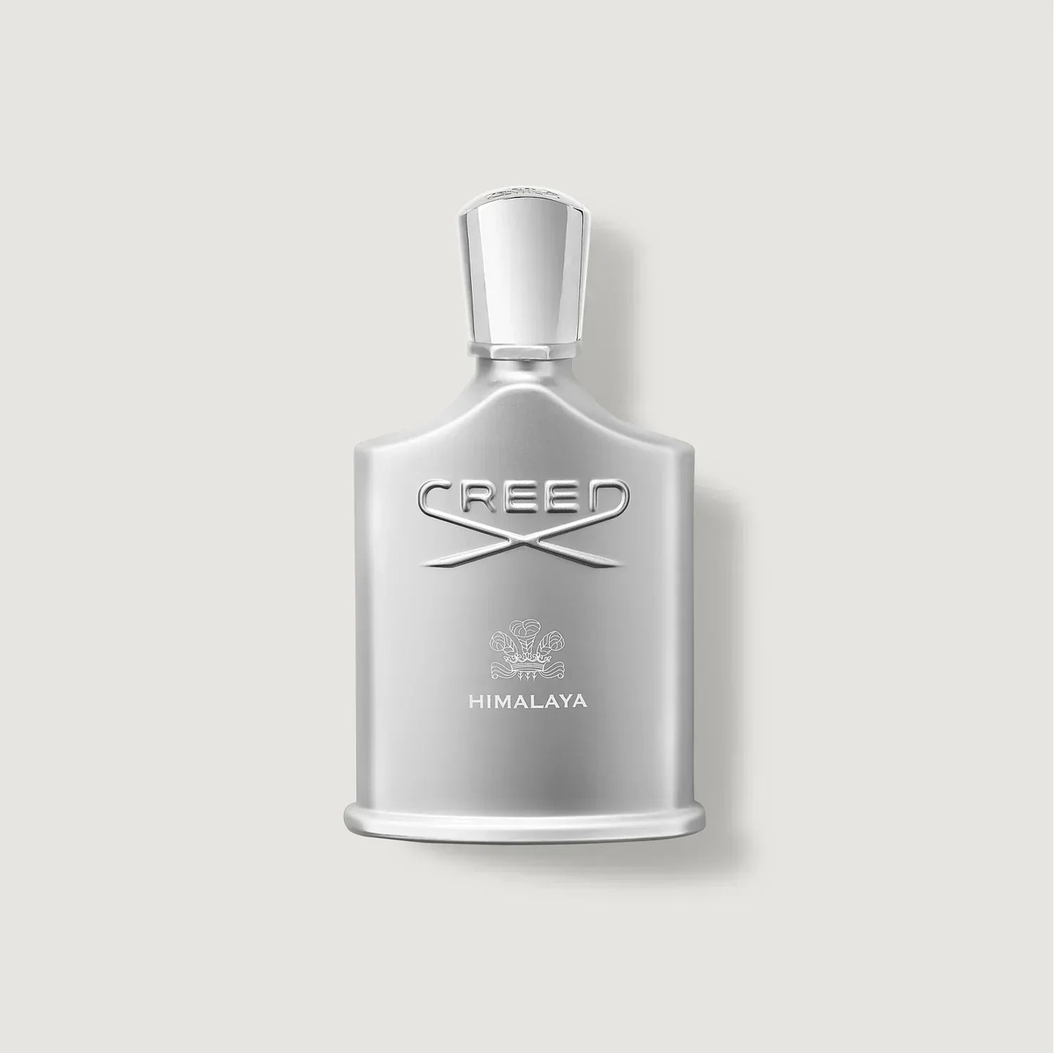 Silver Creed Himalaya perfume bottle on a light gray background