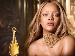 Woman with a gold necklace and a perfume bottle in a luxurious setting